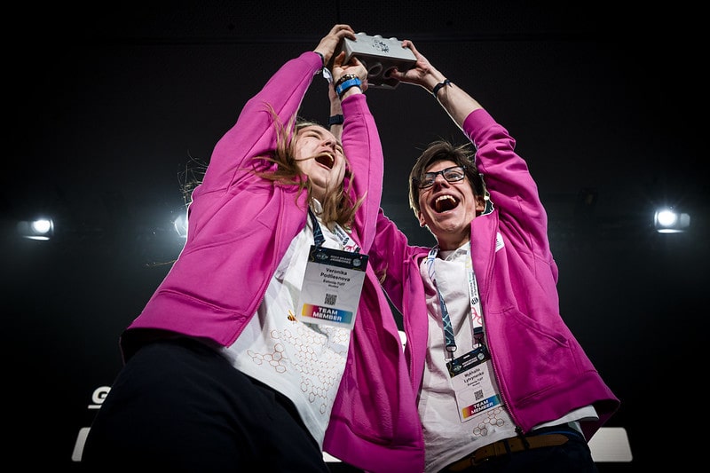 Two winning students celebrating their success