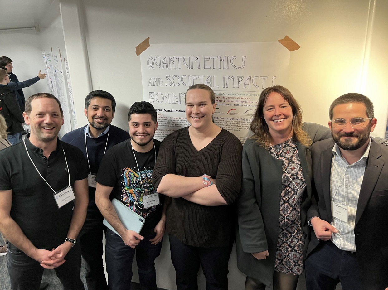 The co-authors of the Quantum Ethics and Societal Impacts Roadmap stand in front of a poster unveiling their essay at the NSF CQN Retreat 2023. Pictured (left) Jonathan Raume (MIT), Taqi Raza (UArizona) Rodrigo Bravo (Harvard), Joan Arrow (Waterloo), Jane Bambauer (UArizona), and David Sidi (UArizona).