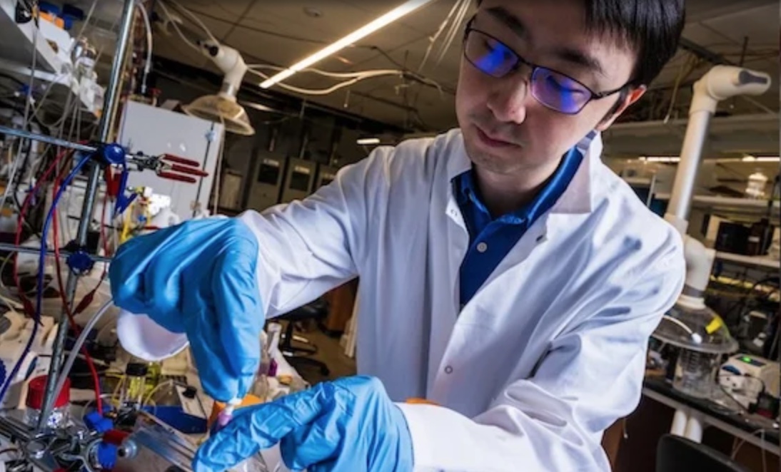 Figure 1: Feng-Yang Chen with the reactor system prototype that is the subject of a new research study published in Nature Catalysis. 