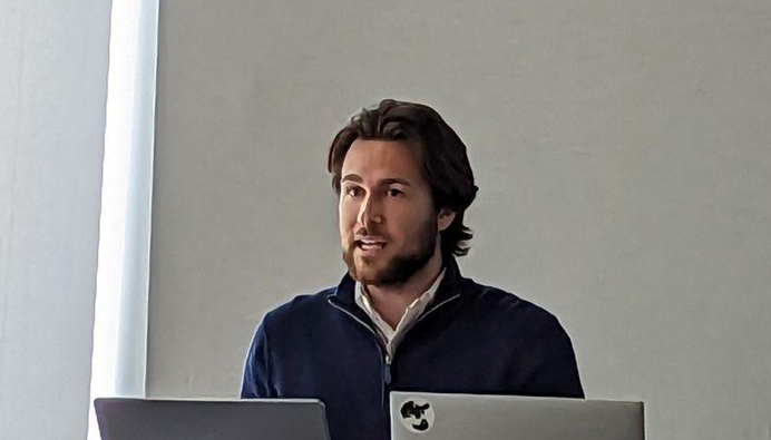 CQN REU student Hunter Kemeny, one of the creators of ChatTutor and ChatCQN, delivers a presentation on his team’s work. 