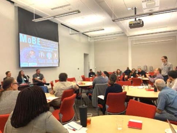 An audience member asks a question at the MoBE workshop. 